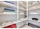 Organized linen closet with neatly arranged towels and storage shelves at 764 Aurora Vale Pl, Henderson, NV 89011