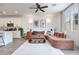 Stylish living room featuring an open floor plan, a plush sofa, and contemporary decor at 764 Aurora Vale Pl, Henderson, NV 89011