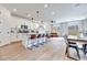 Bright, open-concept space featuring tile floors, a modern kitchen, and comfortable living area at 764 Aurora Vale Pl, Henderson, NV 89011