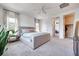 Bedroom with carpet, a bed, large windows, and ensuite bathroom at 764 Aurora Vale Pl, Henderson, NV 89011