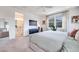 Main bedroom featuring a comfortable bed, TV, and an ensuite bathroom with double sinks at 764 Aurora Vale Pl, Henderson, NV 89011