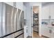 Walk-in pantry with shelving provides ample storage space, located adjacent to a modern kitchen at 764 Aurora Vale Pl, Henderson, NV 89011