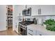 Neatly organized walk-in pantry with shelving to maximize kitchen storage, near stainless appliances at 764 Aurora Vale Pl, Henderson, NV 89011