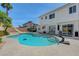The pool and backyard area features a water slide and patio, ideal for relaxation and entertainment at 7726 Keating Cir, Las Vegas, NV 89147