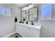 Stylish bathroom featuring double sinks, modern fixtures, and bright lighting at 7726 Keating Cir, Las Vegas, NV 89147