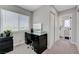Bedroom showcasing a makeup vanity next to a bright window and a double-door closet at 7726 Keating Cir, Las Vegas, NV 89147