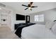 Bedroom featuring a ceiling fan, television, closet, and plush bedding in a calming color scheme at 7726 Keating Cir, Las Vegas, NV 89147