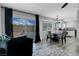 Dining area with table and chairs next to the living room and kitchen at 7726 Keating Cir, Las Vegas, NV 89147