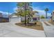 Charming single-story home features a well-maintained front yard and a two-car garage at 7726 Keating Cir, Las Vegas, NV 89147