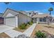 Lovely single-Gathering home with a well-manicured lawn and an attached two-car garage at 7726 Keating Cir, Las Vegas, NV 89147