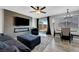 A modern living room with sleek fireplace and TV, plus stylish furniture and decor at 7726 Keating Cir, Las Vegas, NV 89147