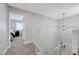 Bright staircase with white railing and modern pendant light, leading to a cozy bedroom view at 7726 Keating Cir, Las Vegas, NV 89147