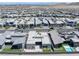 An aerial view of a planned community shows modern homes, lush landscaping, and scenic mountain backdrop at 787 Willits St, Las Vegas, NV 89138