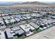 Neighborhood aerial showcasing modern homes, landscaped yards, mountain views, and a built in pool at 787 Willits St, Las Vegas, NV 89138