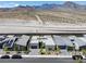 Aerial view of modern gray homes with desert mountain views, gray tiled roofs, and xeriscaped front yards at 787 Willits St, Las Vegas, NV 89138