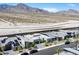 New neighborhood showcasing modern gray homes, desert mountain views, and meticulously xeriscaped front yards at 787 Willits St, Las Vegas, NV 89138