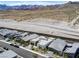 Modern neighborhood features gray homes, desert mountain views, and uniquely xeriscaped yards at 787 Willits St, Las Vegas, NV 89138