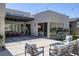 Beautiful backyard showcasing an outdoor dining area, comfortable lounge furniture, and modern design elements at 787 Willits St, Las Vegas, NV 89138