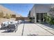 Inviting backyard with a paver patio, stylish outdoor furniture, and mature landscaping for added privacy at 787 Willits St, Las Vegas, NV 89138