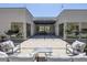Relaxing backyard with an extensive patio, modern seating arrangements, and string lighting for a cozy ambiance at 787 Willits St, Las Vegas, NV 89138