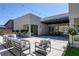 Modern backyard with a large patio, stylish outdoor furniture, and string lights for an inviting atmosphere at 787 Willits St, Las Vegas, NV 89138