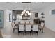 Dining room showcasing modern lighting and seamless flow to the kitchen area at 787 Willits St, Las Vegas, NV 89138