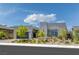View of a modern single story home with desert landscaping, a gray exterior, and a block wall driveway at 787 Willits St, Las Vegas, NV 89138