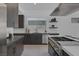 Well-appointed kitchen featuring stainless steel appliances, sleek countertops, and dark wood cabinetry at 787 Willits St, Las Vegas, NV 89138