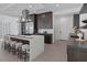 Kitchen featuring a large island with seating, stainless steel appliances, and sleek countertops at 787 Willits St, Las Vegas, NV 89138