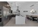 Modern kitchen features a large island with seating, stainless steel appliances, and dark wood cabinetry at 787 Willits St, Las Vegas, NV 89138