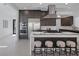 Gourmet kitchen featuring a large island with seating, stainless steel appliances, and custom cabinetry at 787 Willits St, Las Vegas, NV 89138