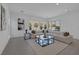 Bright living room features contemporary decor, a plush sectional, and a large window offering natural light at 787 Willits St, Las Vegas, NV 89138