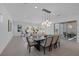 Spacious open-concept living space with modern furnishings, dining area, and access to the outdoors at 787 Willits St, Las Vegas, NV 89138