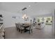 Open concept living space with dining table and comfortable lounge area with view of the backyard at 787 Willits St, Las Vegas, NV 89138