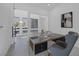 Modern office with glass door and walls, dark wood desk, and modern decor elements at 787 Willits St, Las Vegas, NV 89138