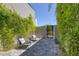 A charming outdoor patio area with modern chairs and lush greenery, providing a peaceful retreat at 787 Willits St, Las Vegas, NV 89138