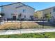 A fenced backyard features newly installed grass or sod, providing a perfect space for outdoor activities at 806 Star Estates Ave, North Las Vegas, NV 89086