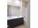 Bathroom featuring a double sink vanity, bathtub, and shower area, providing functionality and style at 806 Star Estates Ave, North Las Vegas, NV 89086