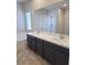 Bathroom with double sink vanity, large mirror, bathtub, and shower for a relaxing experience at 806 Star Estates Ave, North Las Vegas, NV 89086