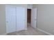 Carpeted bedroom features modern closet doors and neutral color palette at 806 Star Estates Ave, North Las Vegas, NV 89086