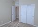 Bedroom featuring modern doors with new carpet and neutral decor at 806 Star Estates Ave, North Las Vegas, NV 89086