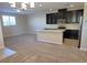 Modern kitchen with granite countertops, stainless steel appliances, and dark cabinetry at 806 Star Estates Ave, North Las Vegas, NV 89086