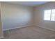 Bright living room filled with natural light and neutral carpet and walls at 806 Star Estates Ave, North Las Vegas, NV 89086