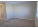 Neutral carpeted living room with a large wall space ideal for media or artwork at 806 Star Estates Ave, North Las Vegas, NV 89086
