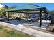 A shaded picnic area offers tables and seating near the community playground for convenient outdoor dining at 806 Star Estates Ave, North Las Vegas, NV 89086