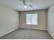 Another view of the bedroom with ceiling fan and natural light from the window at 8070 W Russell Rd # 2121, Las Vegas, NV 89113