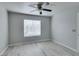 This bedroom has light walls, light floors, and a window with blinds at 8070 W Russell Rd # 2121, Las Vegas, NV 89113
