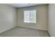 Neutral carpeted bedroom with a window for natural light and ventilation at 8070 W Russell Rd # 2121, Las Vegas, NV 89113