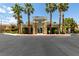 Attractive clubhouse entrance with palm trees offers a welcoming focal point for residents at 8070 W Russell Rd # 2121, Las Vegas, NV 89113