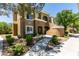 Inviting two-story condo building with mature trees and well-maintained landscaping at 8070 W Russell Rd # 2121, Las Vegas, NV 89113